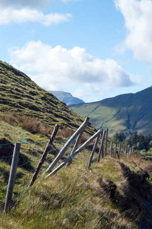 A fence on the side of a mountainの写真素材