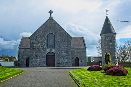 A view of a church with a tower to the front and side of it.のeditorial素材