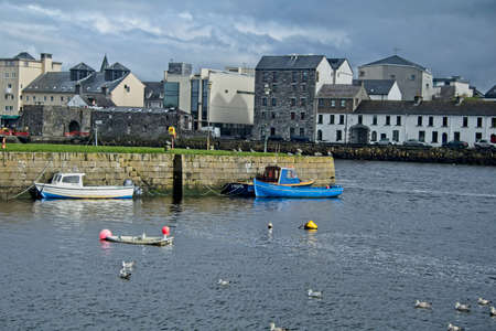 View of Long Walk, Galway with water in the foregroundのeditorial素材