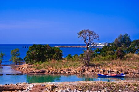 the boat in the landscape of colorsの写真素材