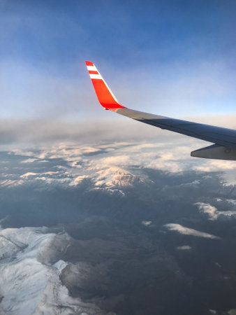 View from the window of the plane on the wing on a sunny dayの写真素材