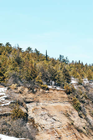 A view of the snow-covered valley from the top of the mountain.