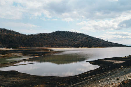 Lake in the mountains on a cloudy day. Beautiful natural landscape.の写真素材