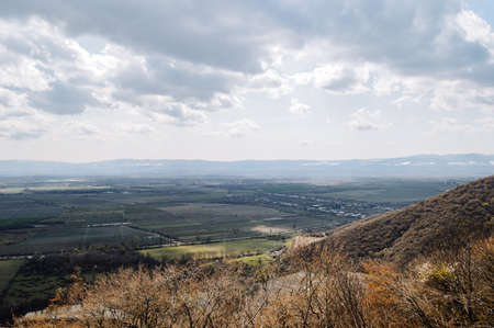 View of the valley from the top of the mountain in the clouds