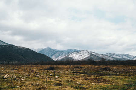 Landscape with snow-capped mountains in the background. High quality photoの写真素材