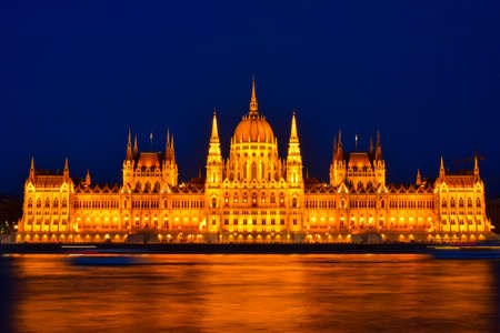 Long exposure shot of The Hungarian Parliament Building at night. One of Europe's oldest legislative buildings and one of the most beautiful buildings in the Hungarian capital. Budapest, Hungaryの写真素材