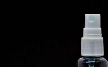Close up shot of white spray nozzle dispenser in black background. with space for free textの写真素材