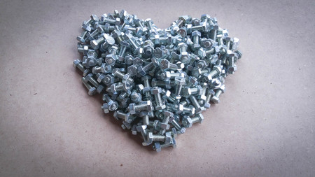 A pile of Nut and bolt with blank for text.の写真素材