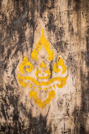 Wooden background with yellow symbol of religionの写真素材
