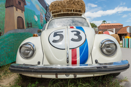 Thailand - Aug 29 2013, Volkswagen beetle car with racing stripes parked in Farmのeditorial素材