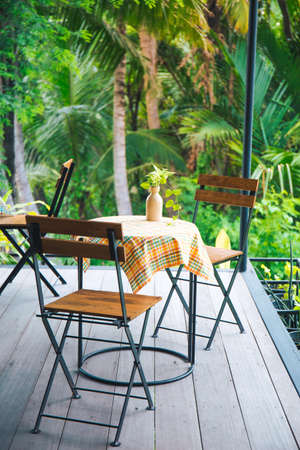Table and wooden chairs with steel in the coffee shopの写真素材