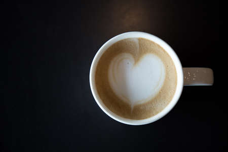 Drawing hearts on coffee art.の写真素材