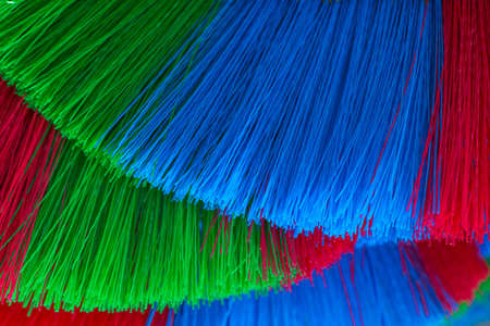 The colorful and patterns of plastic brooms.Soft focusの写真素材