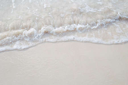 The movement of the waves on the sand is smooth and fine for  background,Soft focus