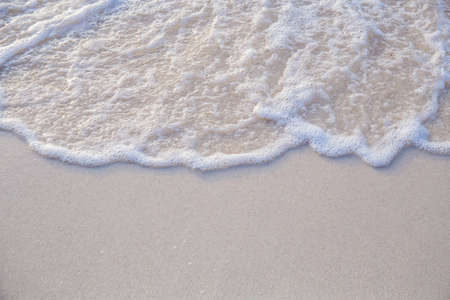 The movement of the waves on the sand is smooth and fine for  background,Soft focus