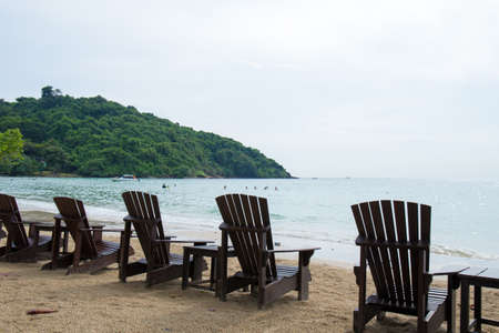 Wooden chairs for vacations and relax at the beachの写真素材