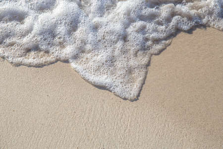 The movement of the waves on the sand is smooth and fine for  background,Soft focusの写真素材