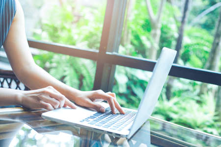 Business woman working with a laptop computer in the office.