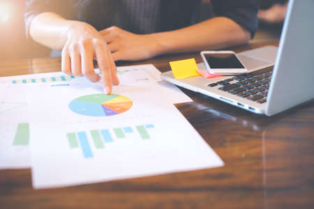 Businessman analysis working discussing the charts and graphs showing the results.の写真素材