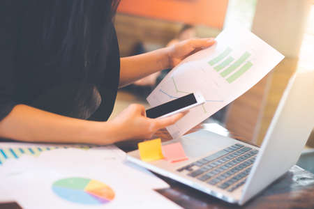 Businessman analysis working discussing the charts and graphs showing the results.