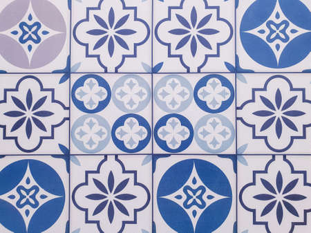 The pattern of the tile floor on the wall.Classic pattern
