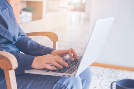 Business women hand use laptop computer in office.の写真素材