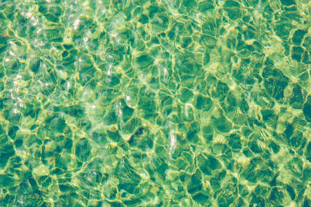 Sun light reflecting or sparkling glitter on water of sea or ocean.の写真素材