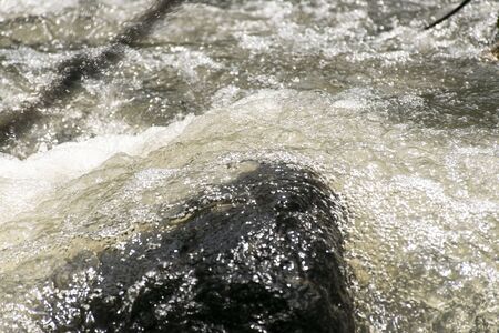 water foam of the water fall impact on the rock. Beauty of nature.の写真素材