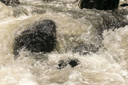 water foam of the water fall impact on the rock. Beauty of nature.