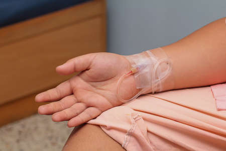 Salt was thrust into the arms of the patient,IV tube.の写真素材