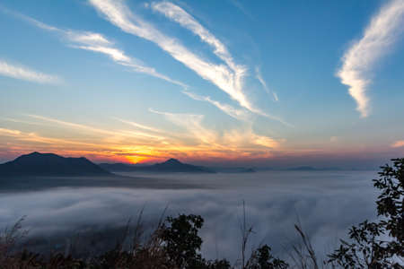 The morning sun with clouds. The fresh morning air, with the sun shining. Mist coveredの写真素材