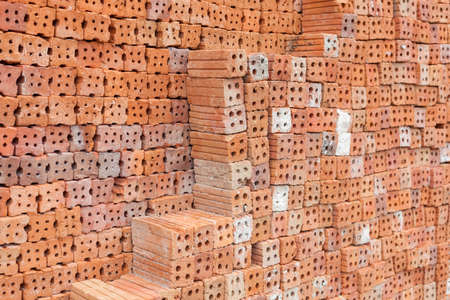 Red brick overlap.Red brick used in the construction of the wall.Red brick made of clay fireの写真素材