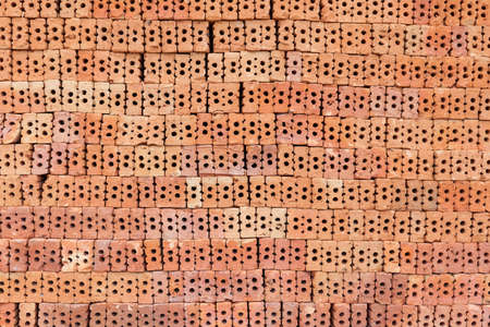 Red brick overlap.Red brick used in the construction of the wall.Red brick made of clay fireの写真素材