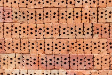Red brick overlap.Red brick used in the construction of the wall.Red brick made of clay fireの写真素材