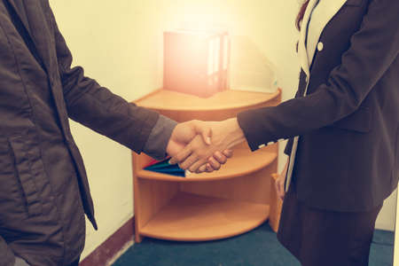 A business woman, she is delighted to be working with a young businessman, Image businesswomen handshake businessman, Business Collaboration, Image Business negotiation.の写真素材