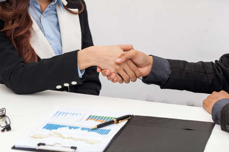 A business woman, she is delighted to be working with a young businessman, Image businesswomen handshake businessman, Business Collaboration, Image Business negotiation.の写真素材