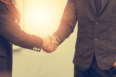 A business woman, she is delighted to be working with a young businessman, Image businesswomen handshake businessman, Business Collaboration, Image Business negotiation.の写真素材