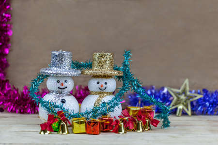 Snow doll on wooden floor.の写真素材