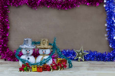 Snow doll on wooden floor.の写真素材