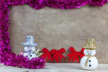 Snow doll on wooden floor.の写真素材