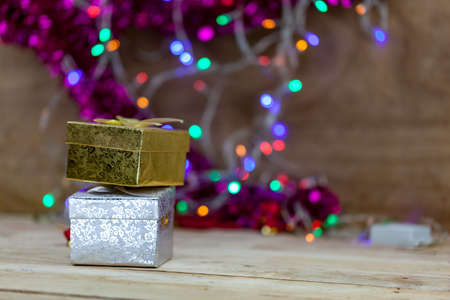 Gold and silver gift box Put on wooden floor.の写真素材