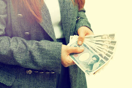 A young investor shows off her profits.の写真素材