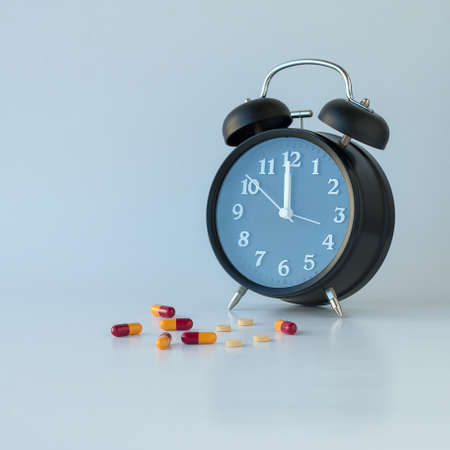 Drug clock on a white background.の写真素材