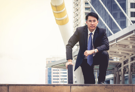 Businessman ready to run for the competition. He start his career and focus to his goal with confident.の写真素材