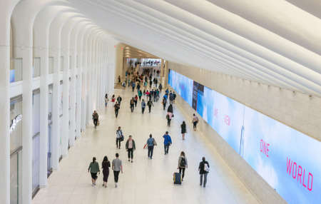 New York City, USA - June 2017 : Inside of the  Westfield World Trade Center. Passengers are walking...