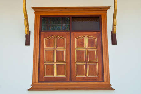 Windows made of teak wood forming a beautifully carvedの写真素材