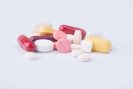Medical pills with various shape, size and color on white background.の写真素材
