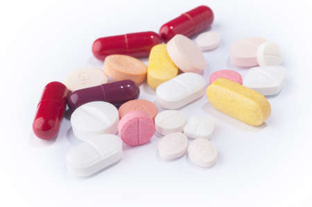 Medical pills with various shape, size and color on white background.の写真素材