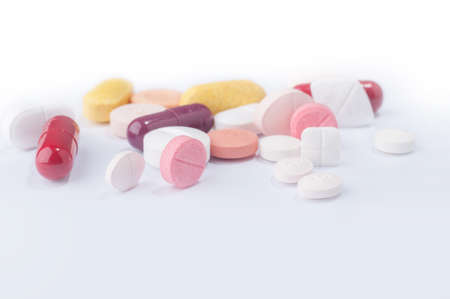 Medical pills with various shape, size and color on white background.の写真素材