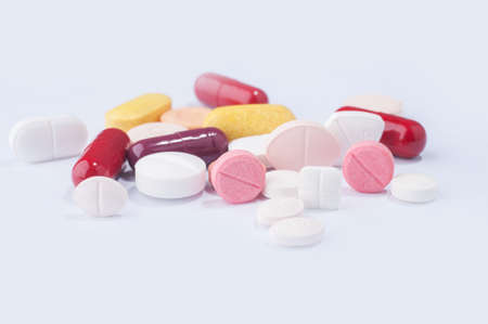 Medical pills with various shape, size and color on white background.の写真素材